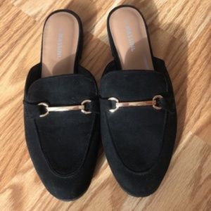 Black dress shoes with gold buckle